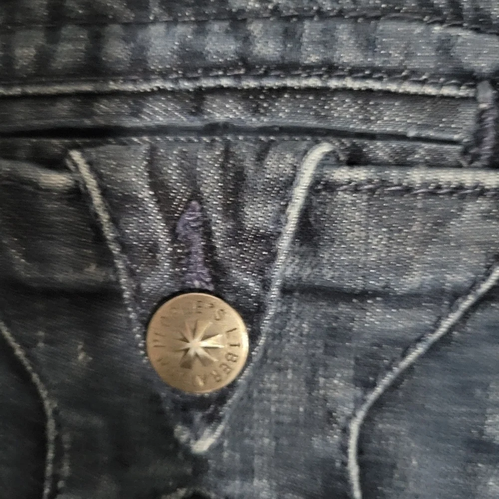 People's Liberation distressed skinny jeans size 25 with star pockets
